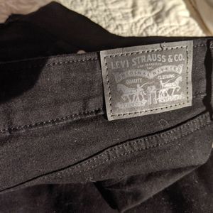 Levi classic mid rise black jeans never worn